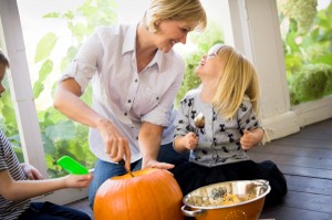 mom-and-kids-carving-pumpkin