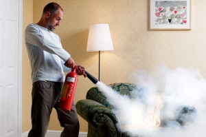 man-fire-extinguisher-home-chair-590kb072910